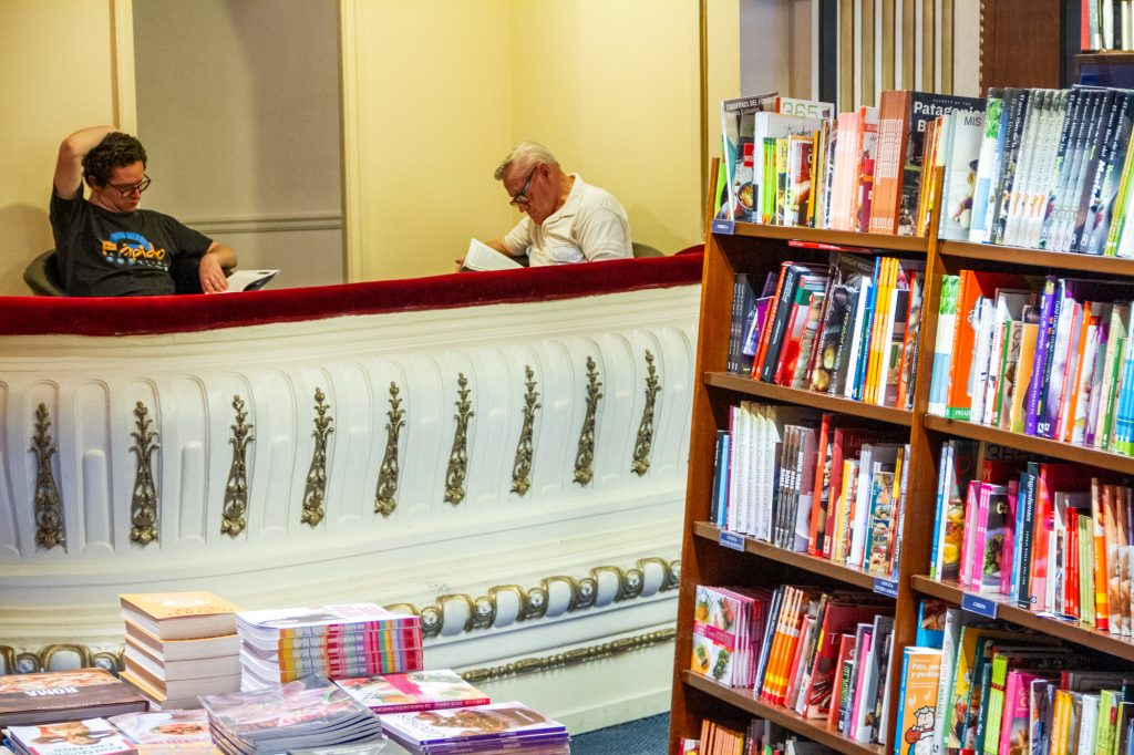 Two men reading in a bookstore in Buenos Aires