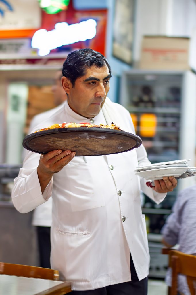 Waiter at a pizza restaurant in Buenos Aires