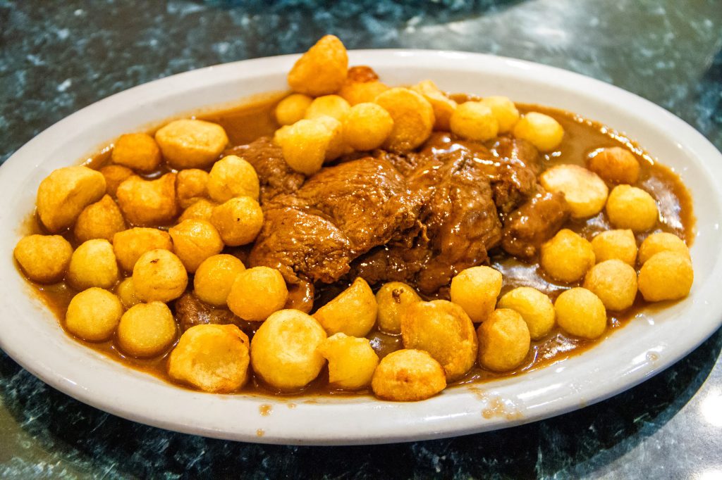 Meat with potato puffs in Buenos Aires